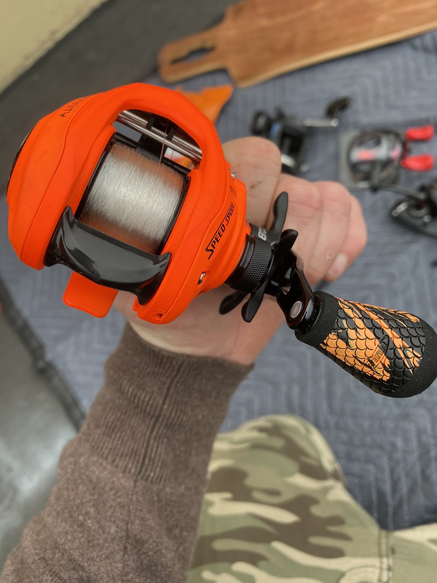 New Lews Neon Orange Bait cast Reel