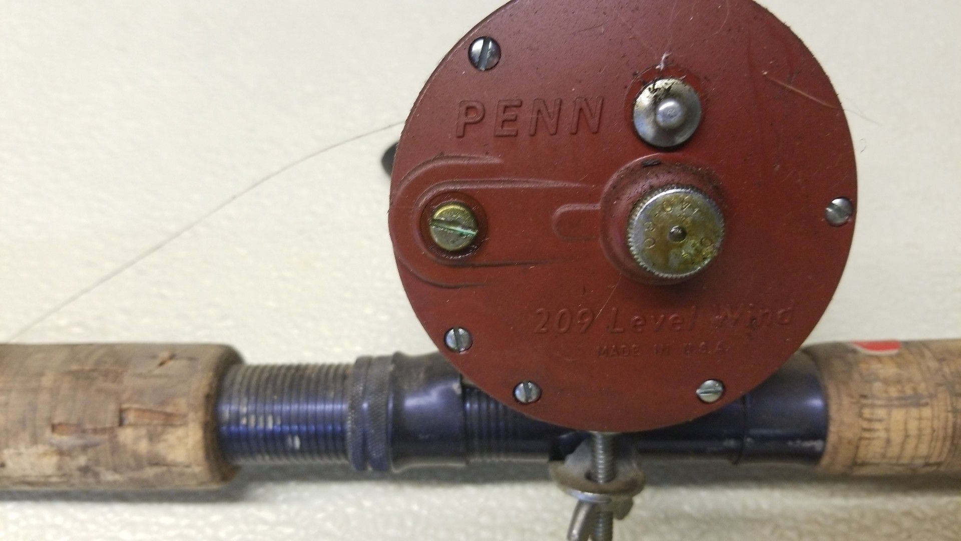 Penn 209 level wind fishing reel with rod