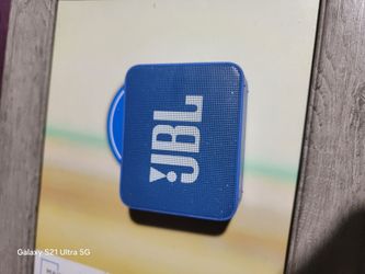 JBL GO portable Bluetooth speaker.