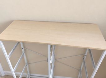 White metal shelving rack with a wood-look top.