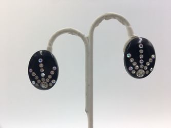 Vintage jet black oval clip on earrings with sunburst design in AB rhinestone