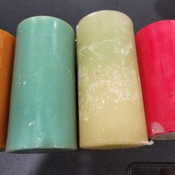 Four large, multiple colors Candles