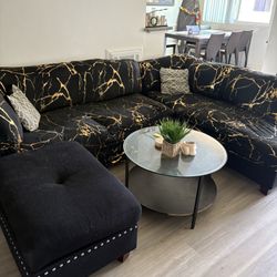 Black Sectional Couch With Patterned Couch Cover