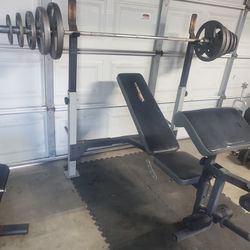 Olympic Weight Set & Adjustable Weight Bench With Leg Developer & Preacher Pad 200lbs all together 