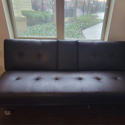 Leather Futon with Cupholders and Pillows.