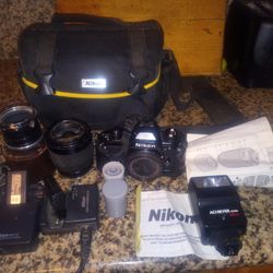 Nikon Camera With Battery And Charger Flash And Bag