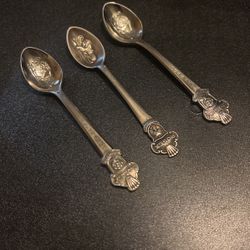 three Rolex spoons
