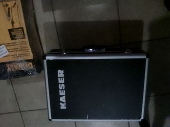Kaeser smartpipe compressor with key and DeWalt universal attachment brush cutter