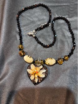 Flowered necklace. New. Great gift