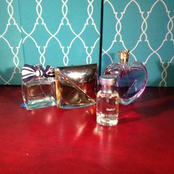 FOUR FULL BOTTLES NO BOXES PERFUME