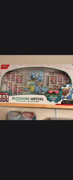 Pokémon Trading Card Game: Scarlet & Violet—151 Blooming Waters Premium Collection box.