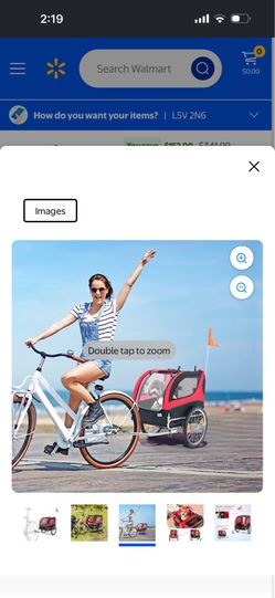 This red pet bike trailer from INFANS includes safety features such as an orange flag and 20-inch wheels for a smooth ride.