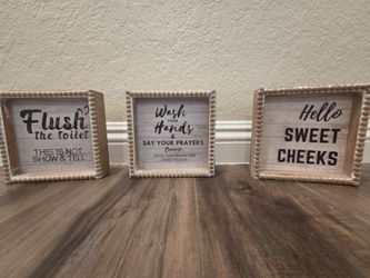 Rustic bathroom signs