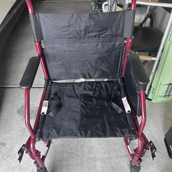 Wheelchair wide and folding with hide away legs for easy transporting.