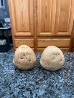 Vintage Ceramic Potato Pair of Salt and Pepper Shakers.  Size approximately 2 1/4 inches tall.  Preowned no chips or cracks.