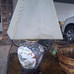 Antique Cinese Lamp With Raised Images Along With Several Wicker Baskets