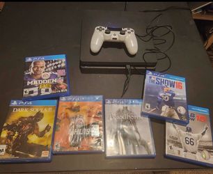 PlayStation 4 Slim console with controller and games