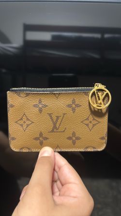 Louis Vuitton Monogram Reverse with the round LV zip pull