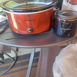 New 5 Quart Hamilton Beach Slow cooker. Comes With 2 Cup Food Warmer.  Never Used.  Has A Small Dent In The Front. 