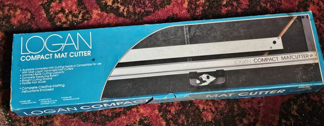 New, never used Logan compact mat cutter. 