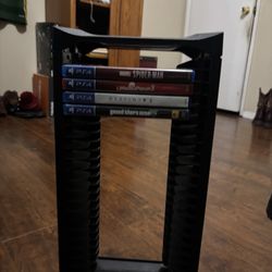 Game Stand With Video Games Including 