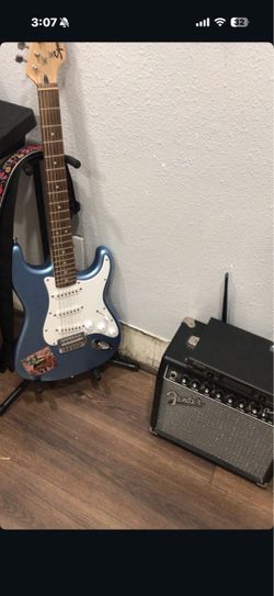 Electric Guitar, Amp, and pedal trio.