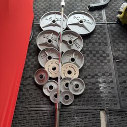 Olympic weights 255lbs total plus 7ft 45lbs bar