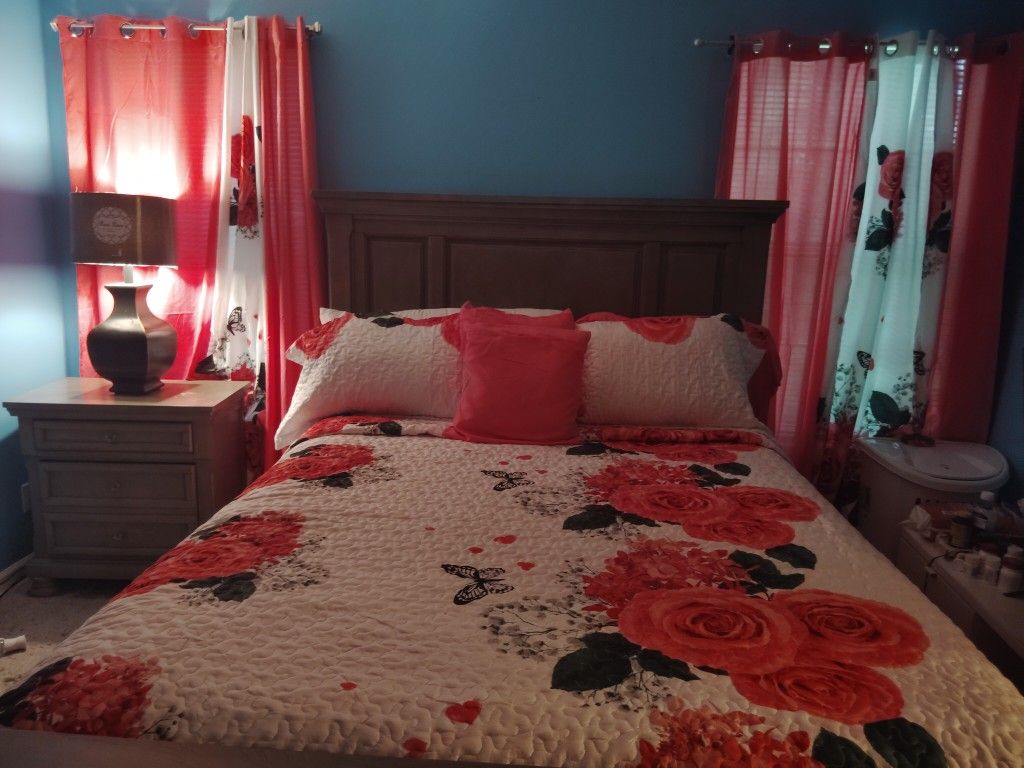 Bed, Lamp, And a dresser with a large mirror