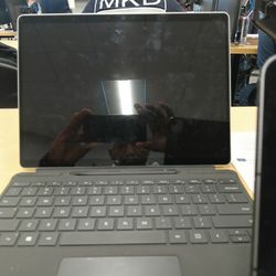 iPad Air With Keyboard And Surface Pro