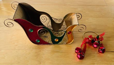 Christmas sleigh, metal, 12 1/2” wideX6” tallX5” taper to 3” deep plus door knob bells.