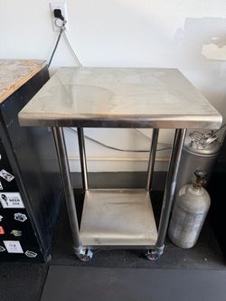 Wheeled stainless steel two section table