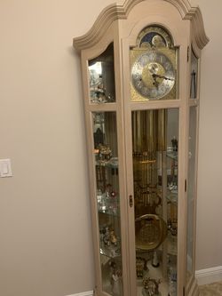 Sleigh grandmother clock with glass shelves