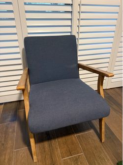 Blue chair with light wood frame