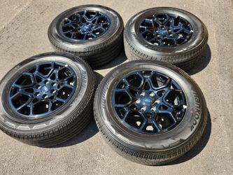 18" ford f150 black factory wheels and tires