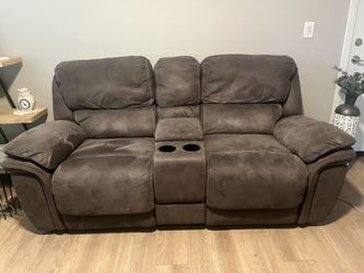 Gray microfiber electric reclining sofa and love seat