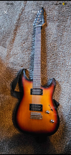 Laguna electric guitar, never played, used as wall art.