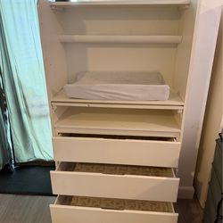 Nursery room changing table with drawers