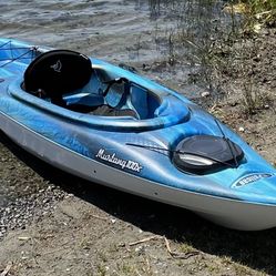 Pelican Mustang 100X one person sit in kayak. Neptune blue/white.