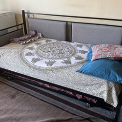 Bed with mattress and rolling frame 