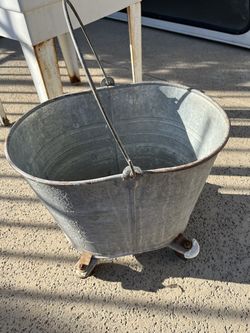 40+ year old vintage galvanized mop bucket on wheels