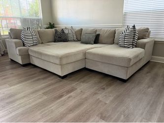 Beautiful beige sectional & ottoman
