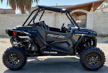 2023 Polaris RZR XP 1000 Sport Only 300 miles and only 50 hours Roof, Rear view mirror, Harness seatbelts, and Lower door inserts Serviced and Ready