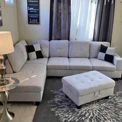 Gray linen sectional couch and ottoman