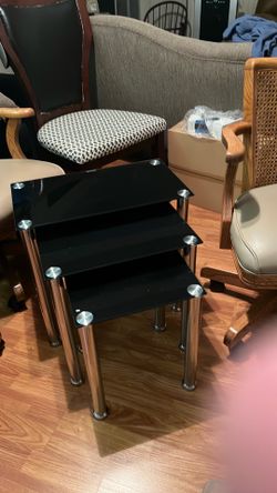 Set of three glass nestling tables perfect for both side of the chair