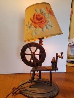 Vintage wooden spinning wheel lamp.