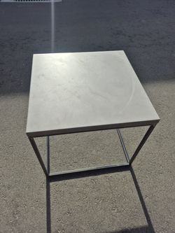 Solid metal end table