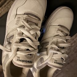 Cream and white New Balance 550 trainers