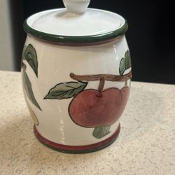 Cream Colored Wood Wick Candle In A White Fruit Container With Lid