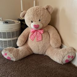 beige medium sized teddy bear 