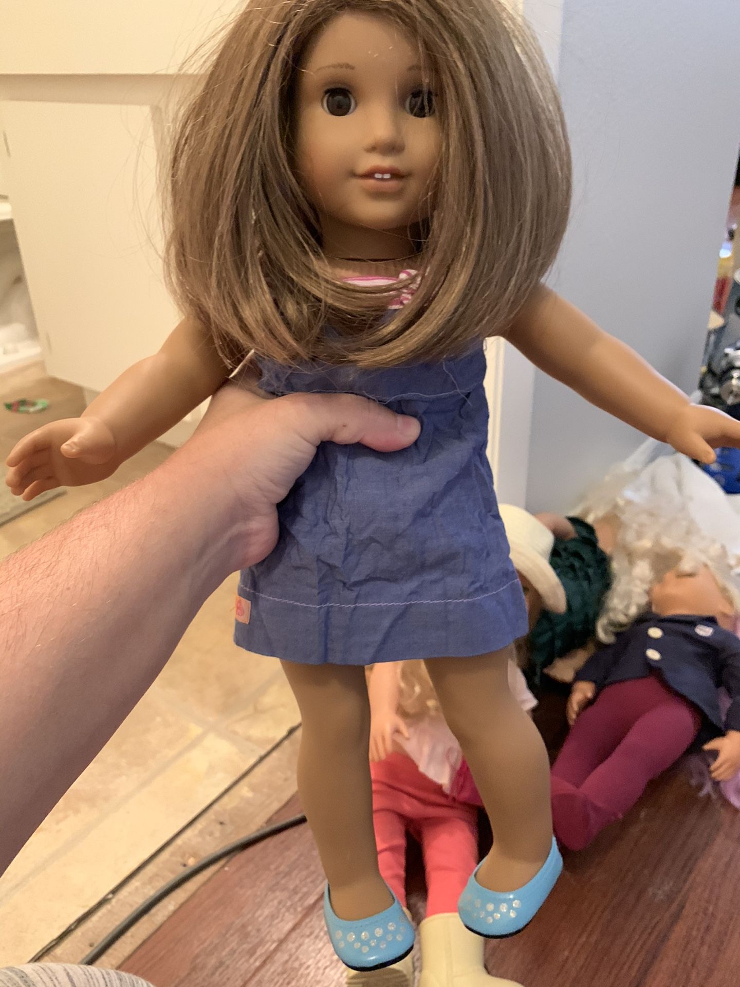 American girl doll with one set of earrings